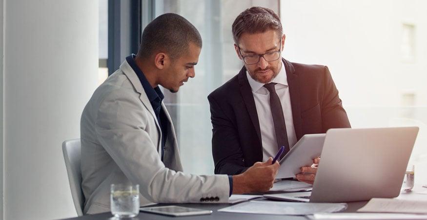 two businessmen discussing data 