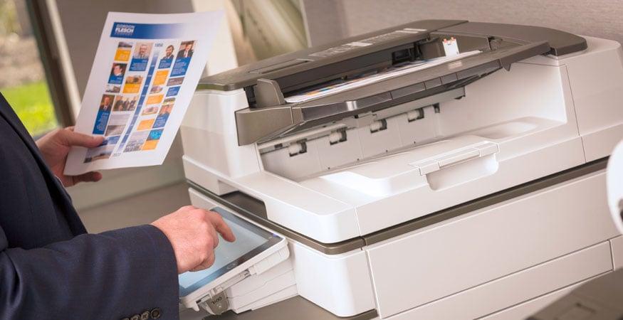 person using a multifunction printer