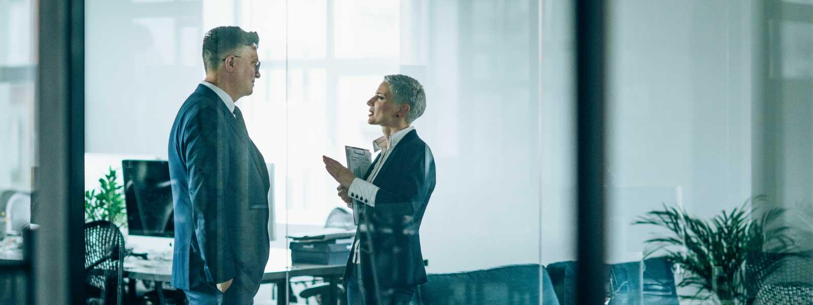 lawyers_discussing_case_in_glass_conference_room