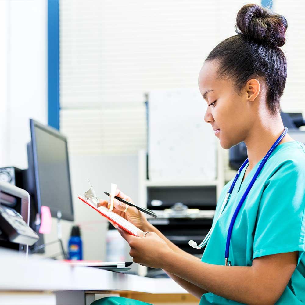 nurse_checking_paperwork_at_station