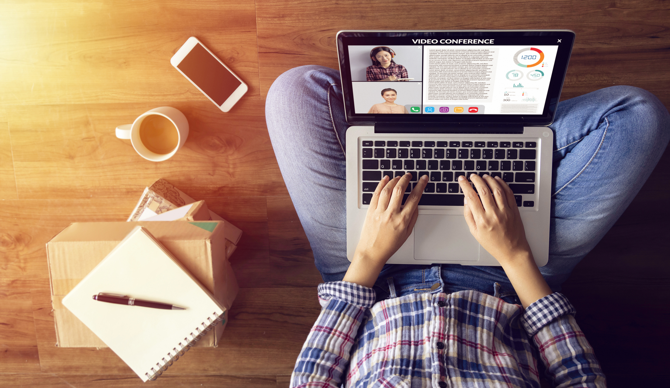 person-sitting-on-floor-typing-on-laptop